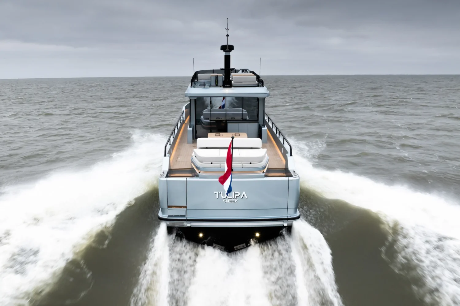 Rear view of a motor yacht at speed