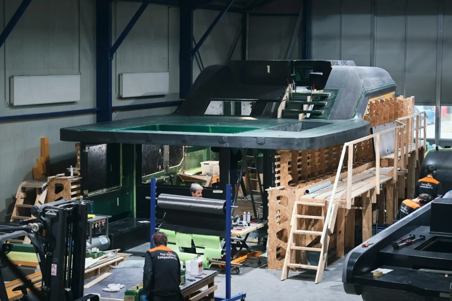 Yacht superstructure on a wooden building frame in the workshop