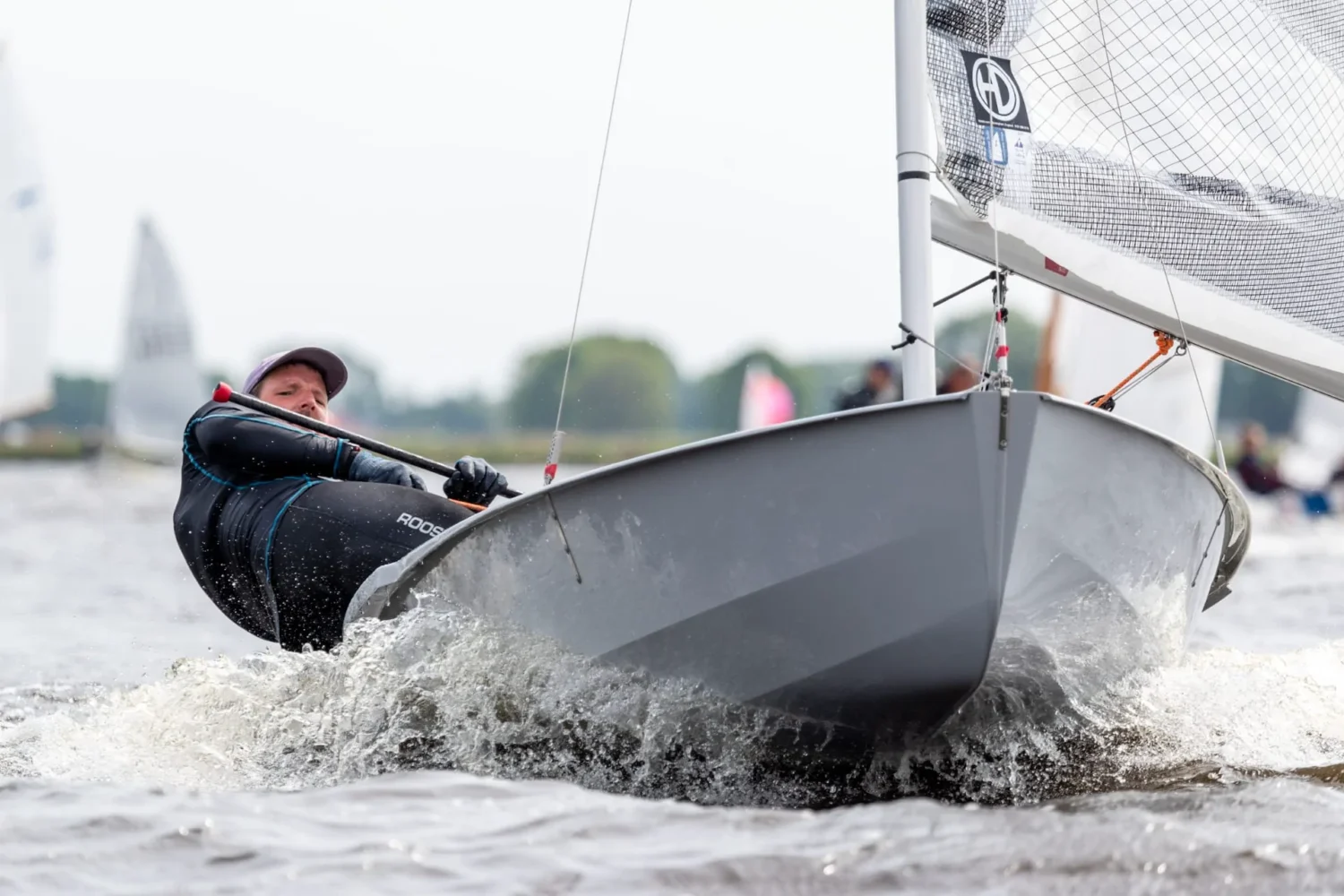 Sailor hiking out in a small racing boat