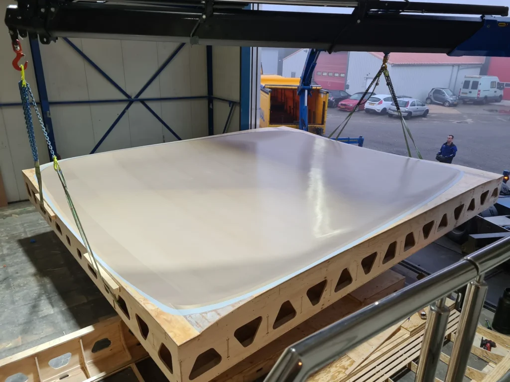 White mould plate on a wooden support frame