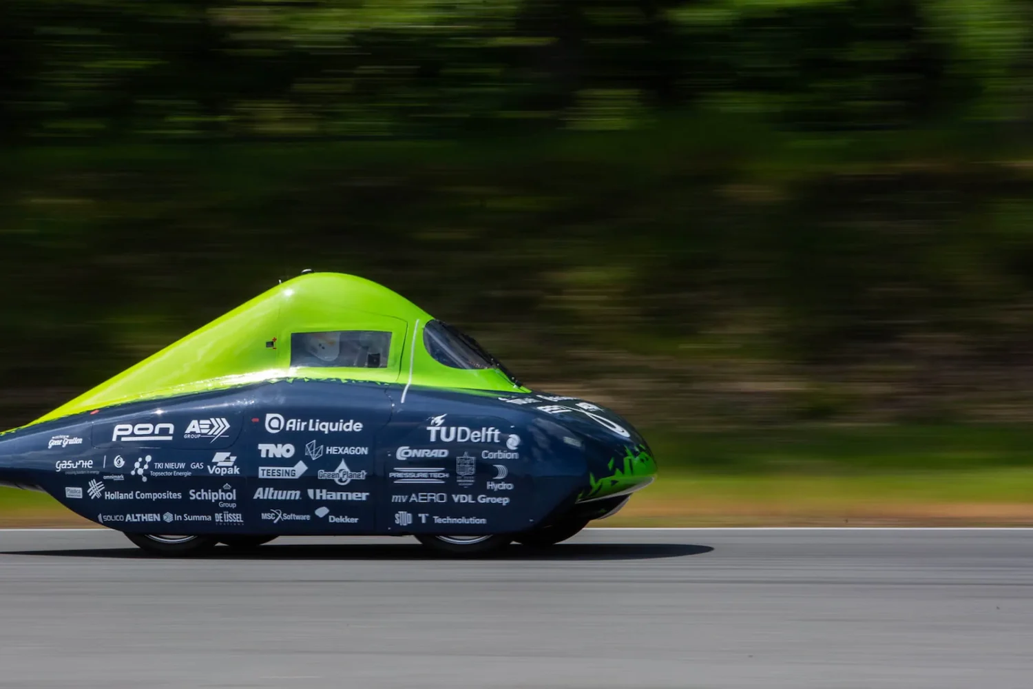 Streamlined teal car on a test track