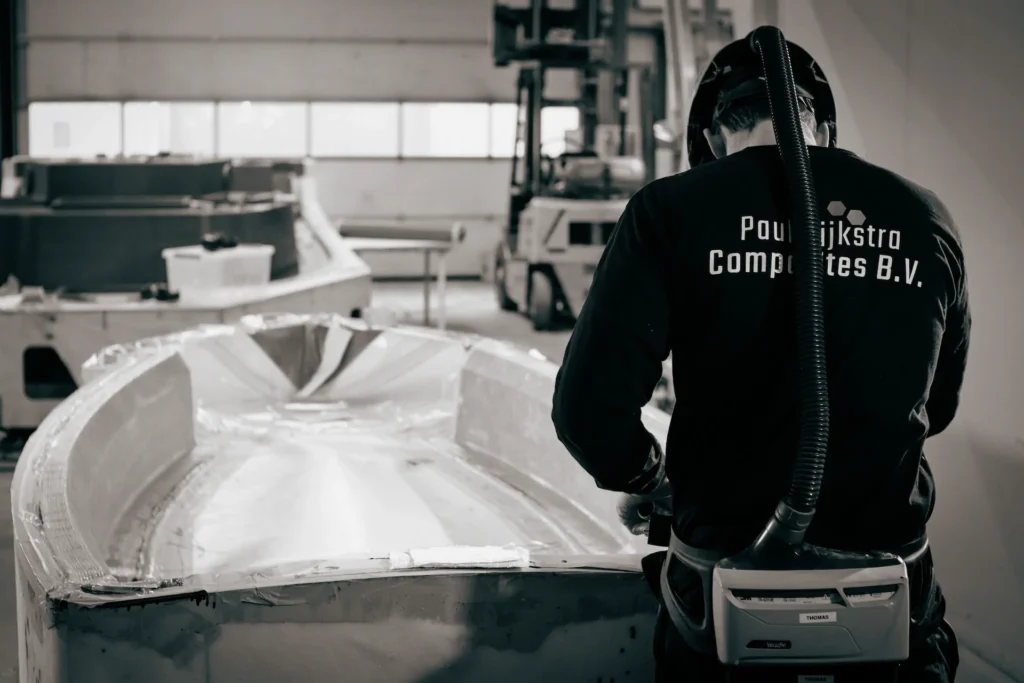 Employee inspecting a lightweight hull structure