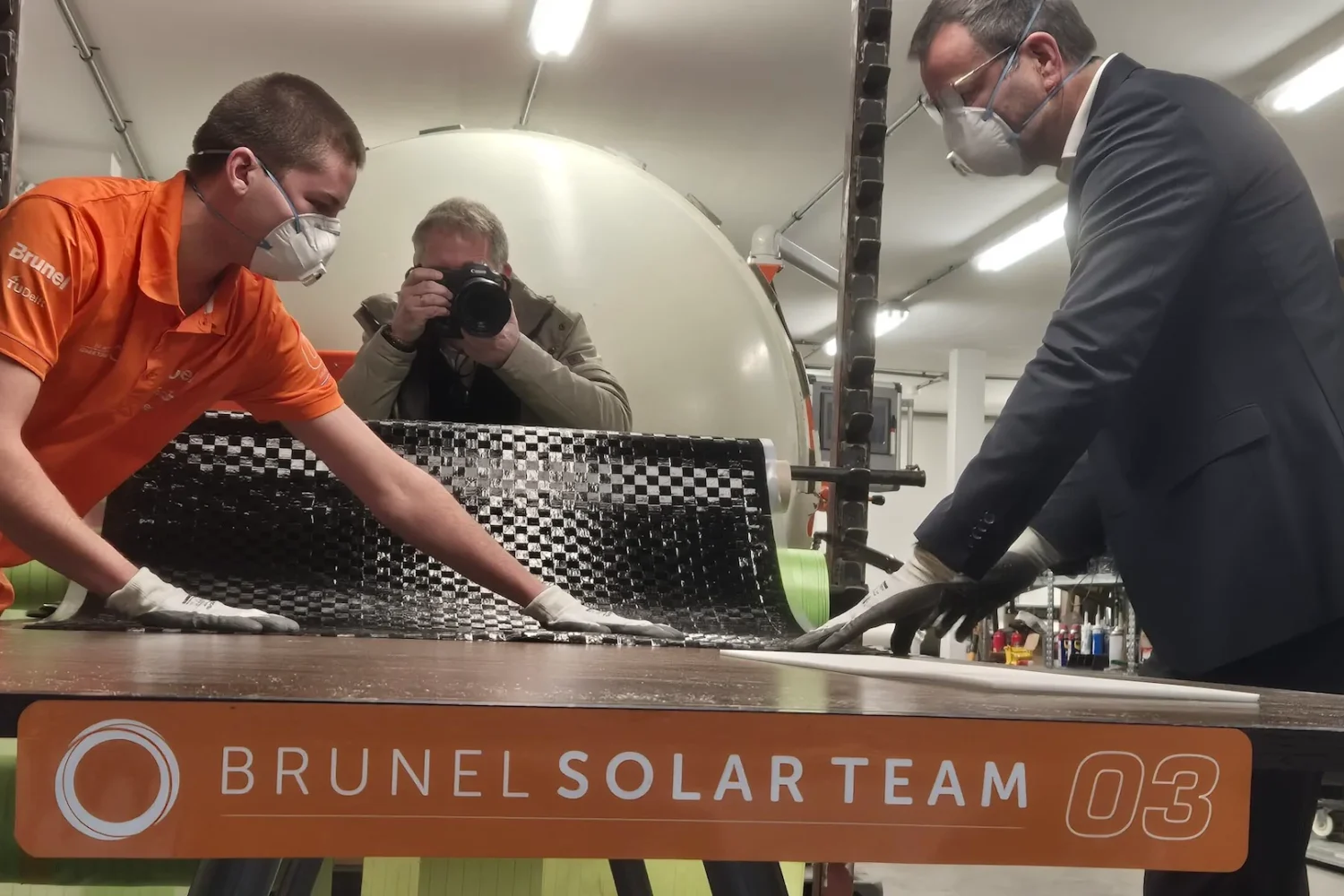 Brunel Solar Team members working on a solar car