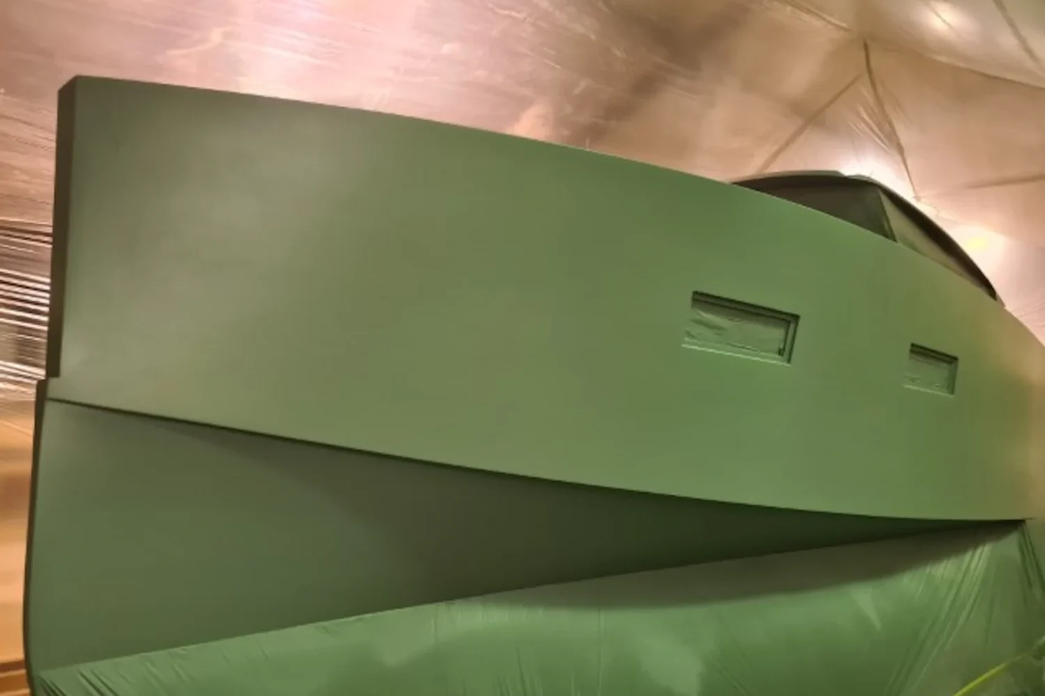 Green boat hull in the workshop