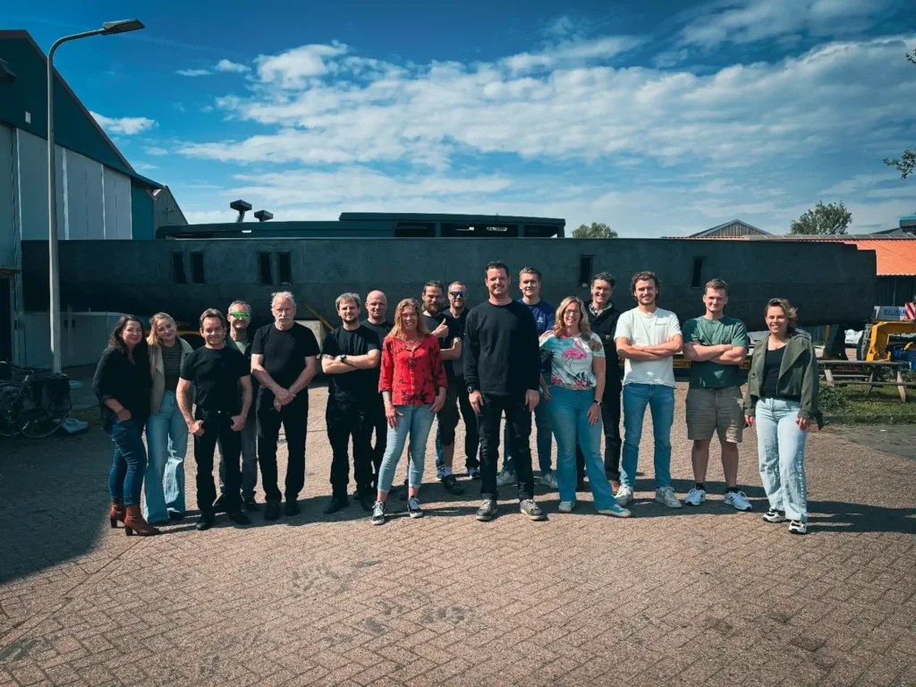 Team photo outside in front of the workshop