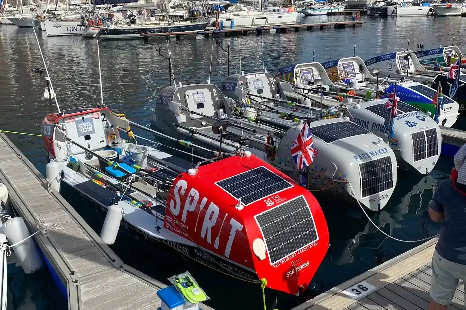 Ocean rowing boats side by side in a marina
