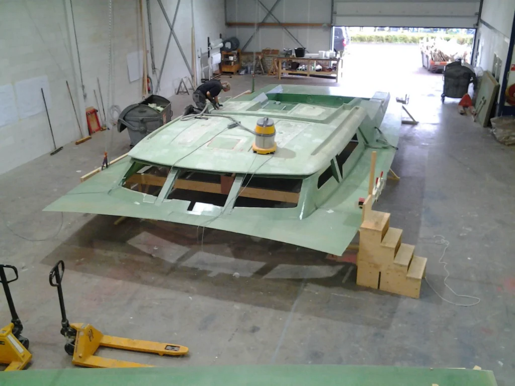 Green yacht superstructure on wooden supports