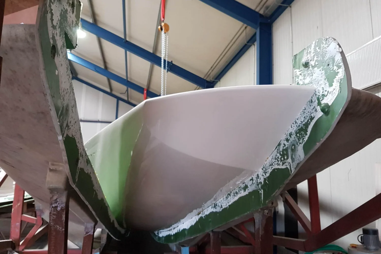 Curved boat component being removed from the mold