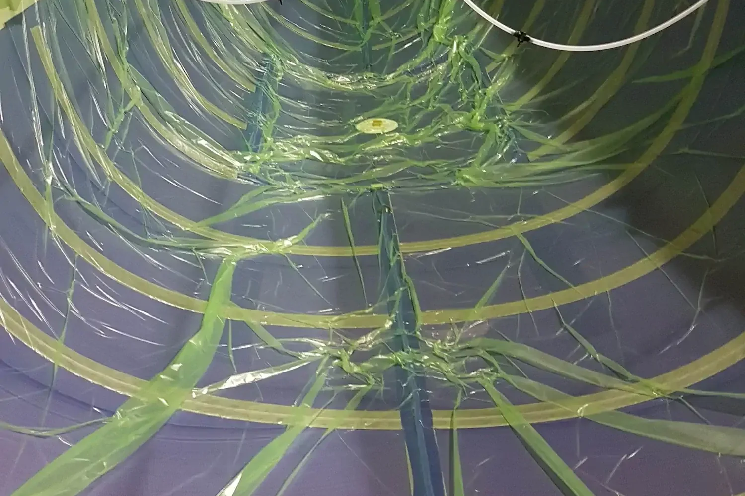Vacuum bagging film and hoses along the inside of a hull