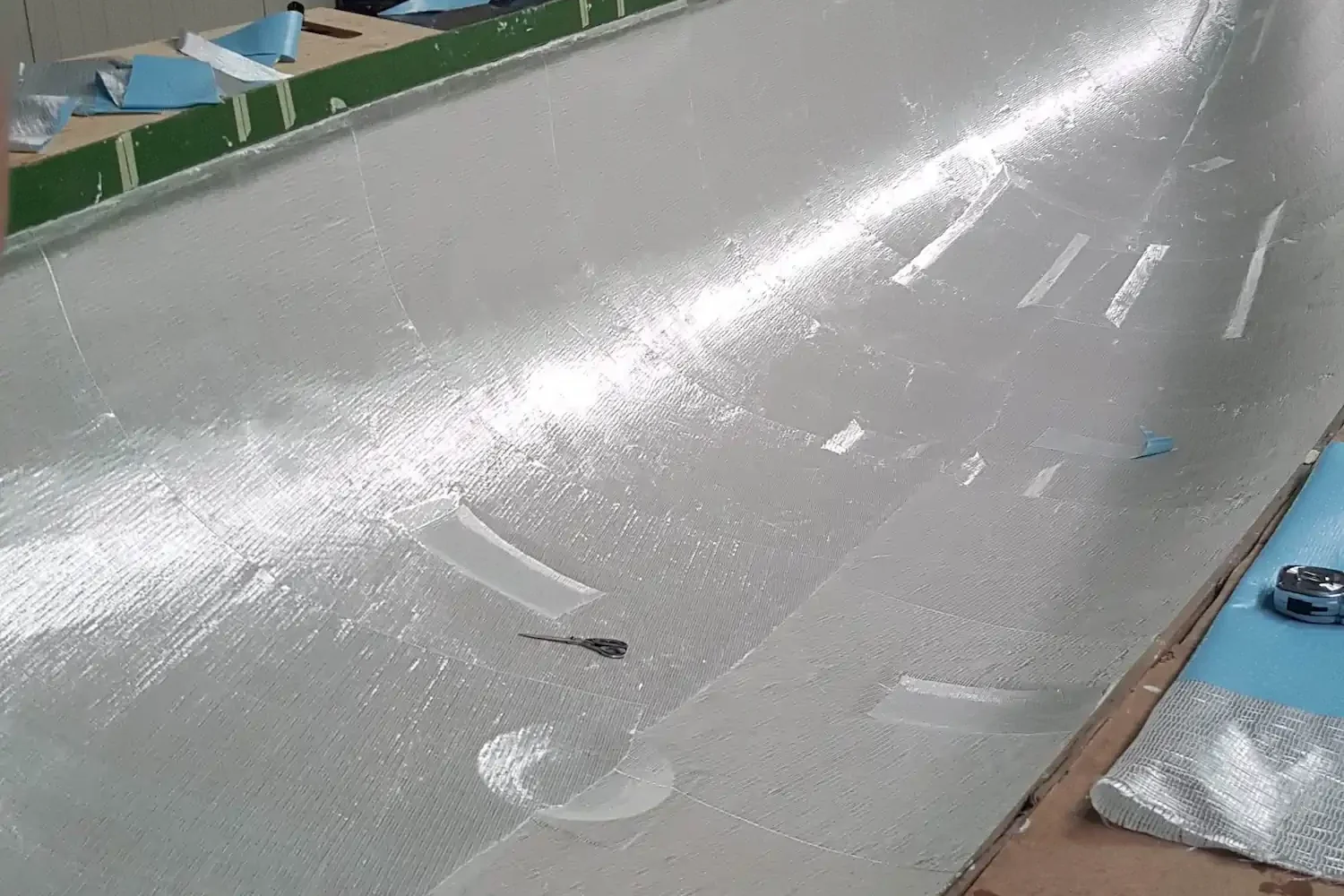Gray boat hull in the workshop