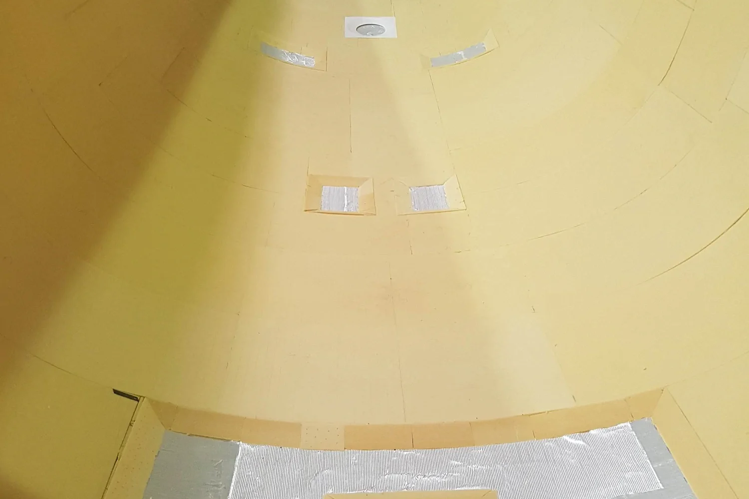 Light-colored interior of a boat hull under construction