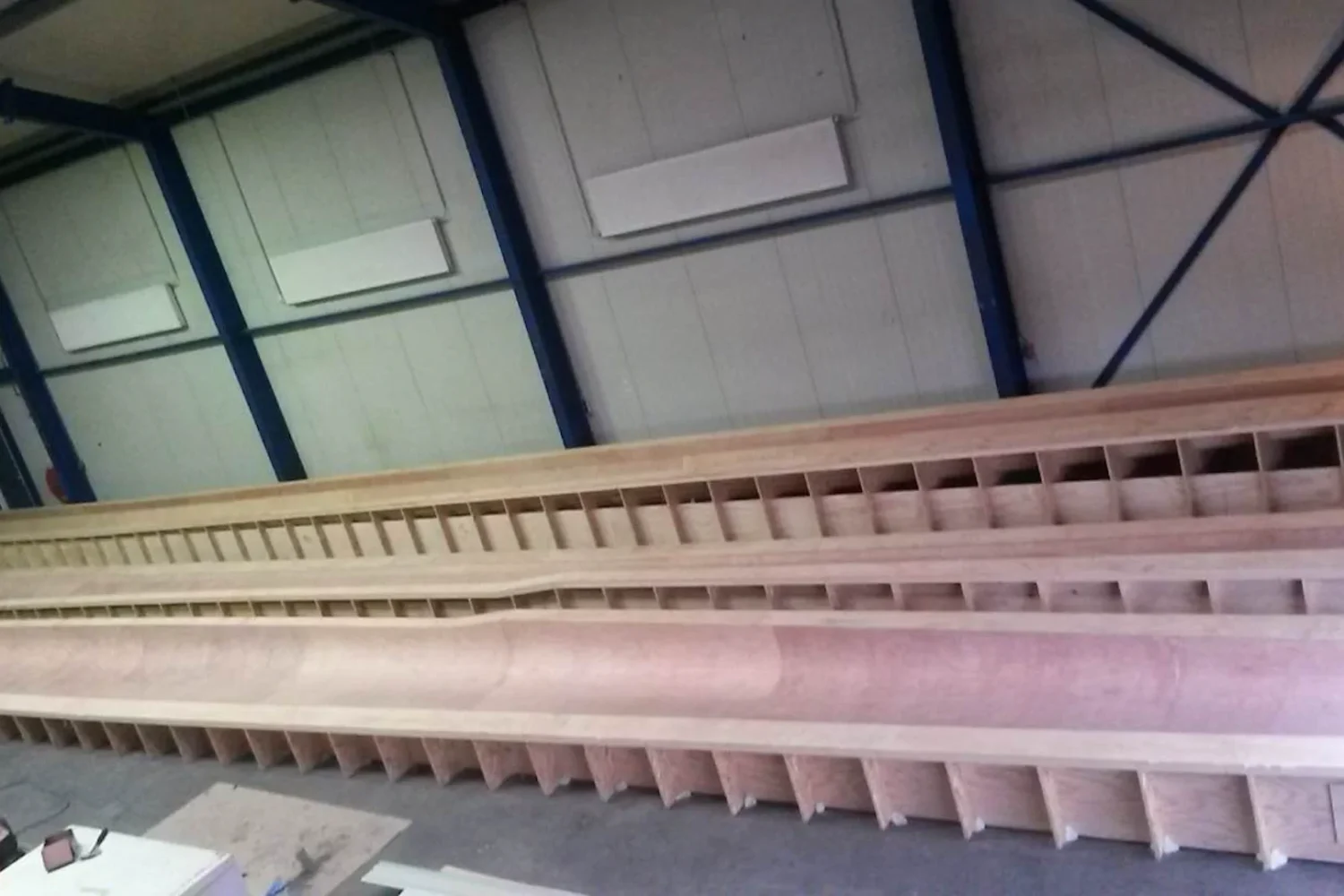 Long mold sections lined up in the workshop