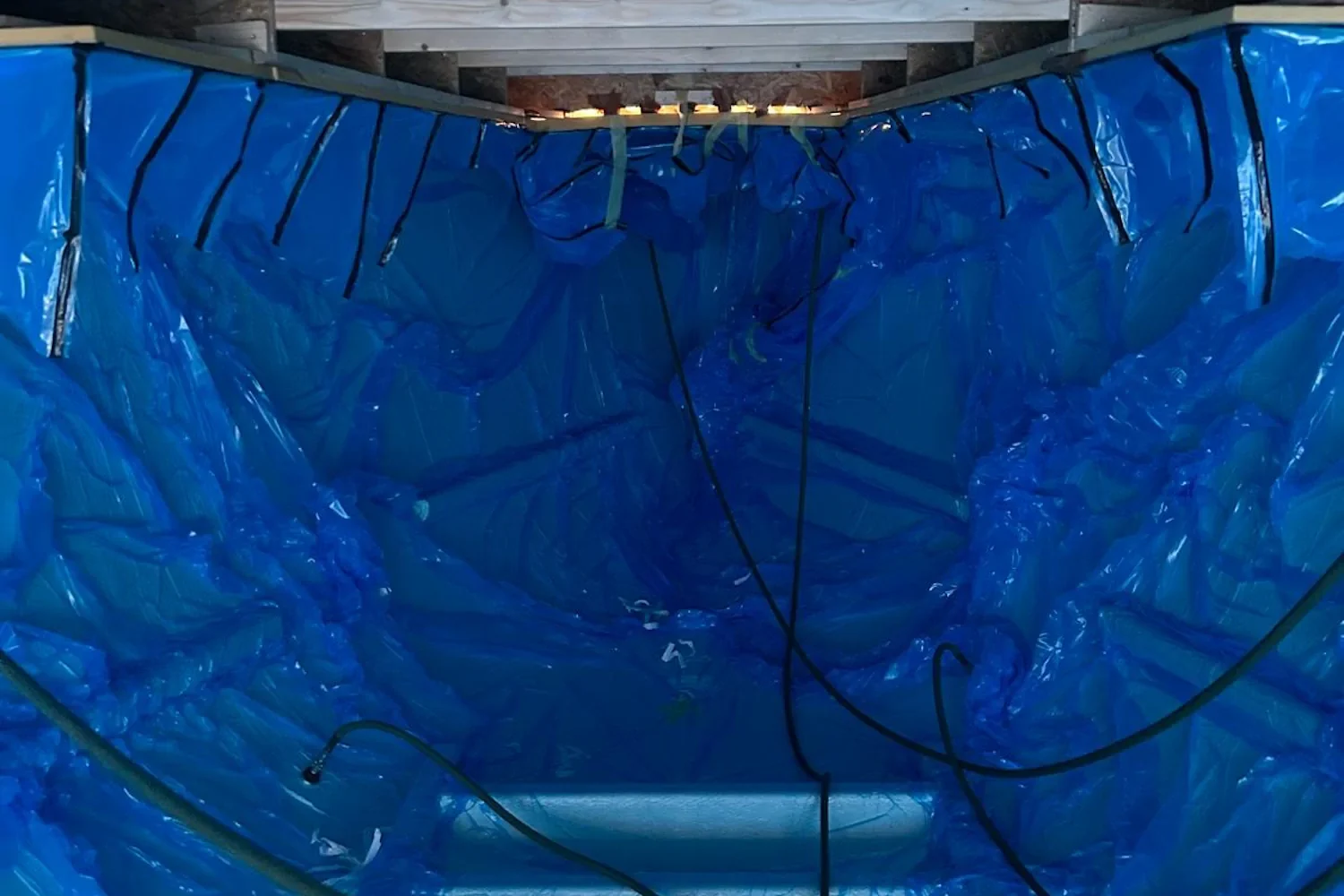 Blue vacuum film over a boat structure