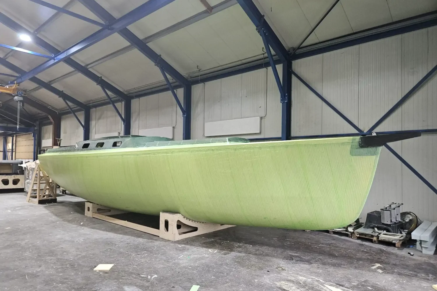 Light green boat hull in the workshop
