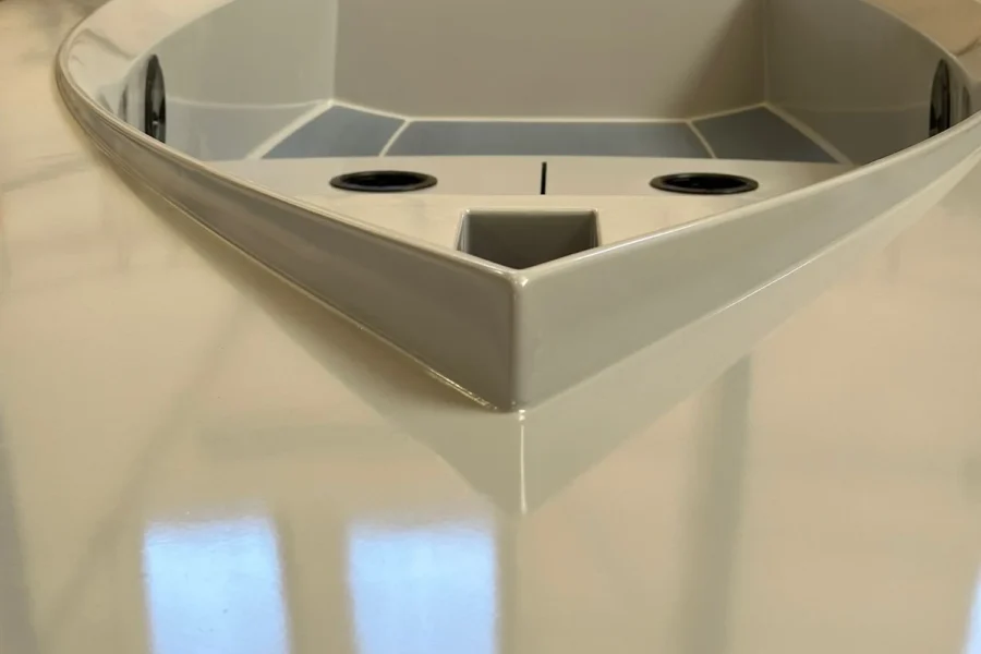 White cockpit of a small sailboat in the workshop
