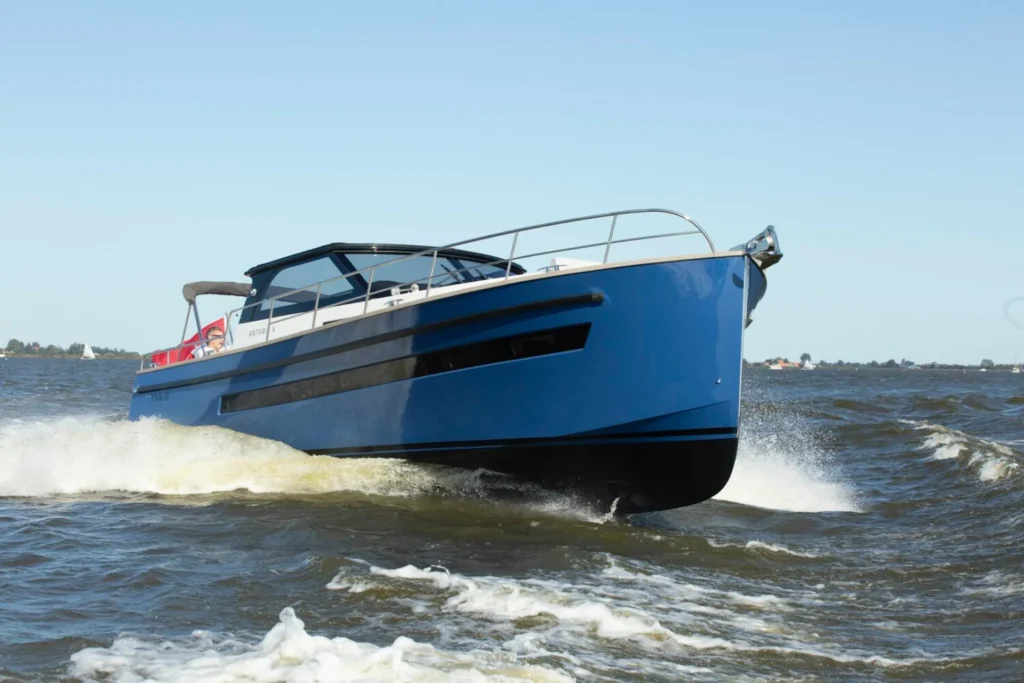 Blue motorboat cruising on the water