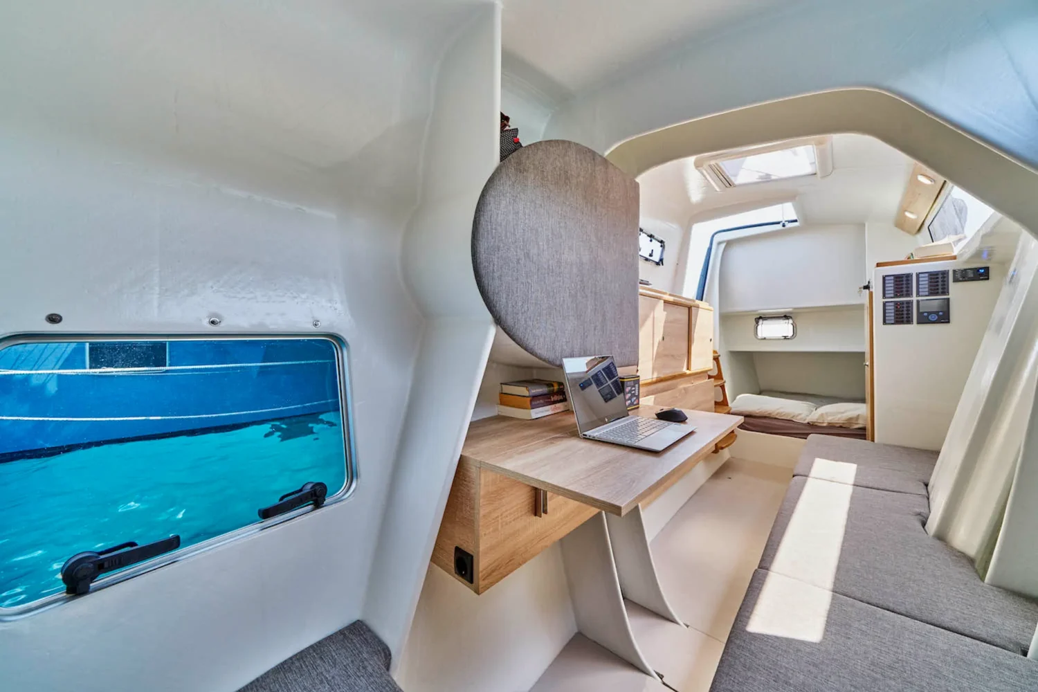 Interior of a catamaran with a table and storage space