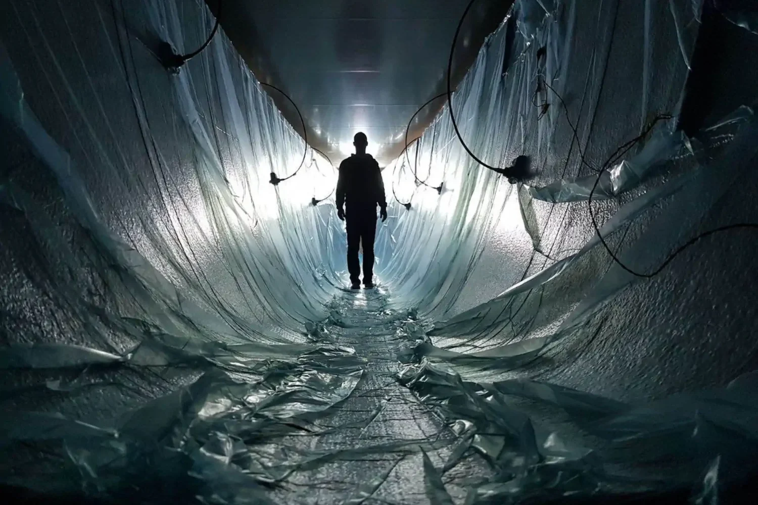 Worker inside a hull mold lined with film