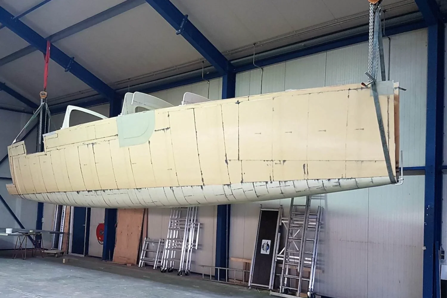Catamaran hull suspended in the workshop