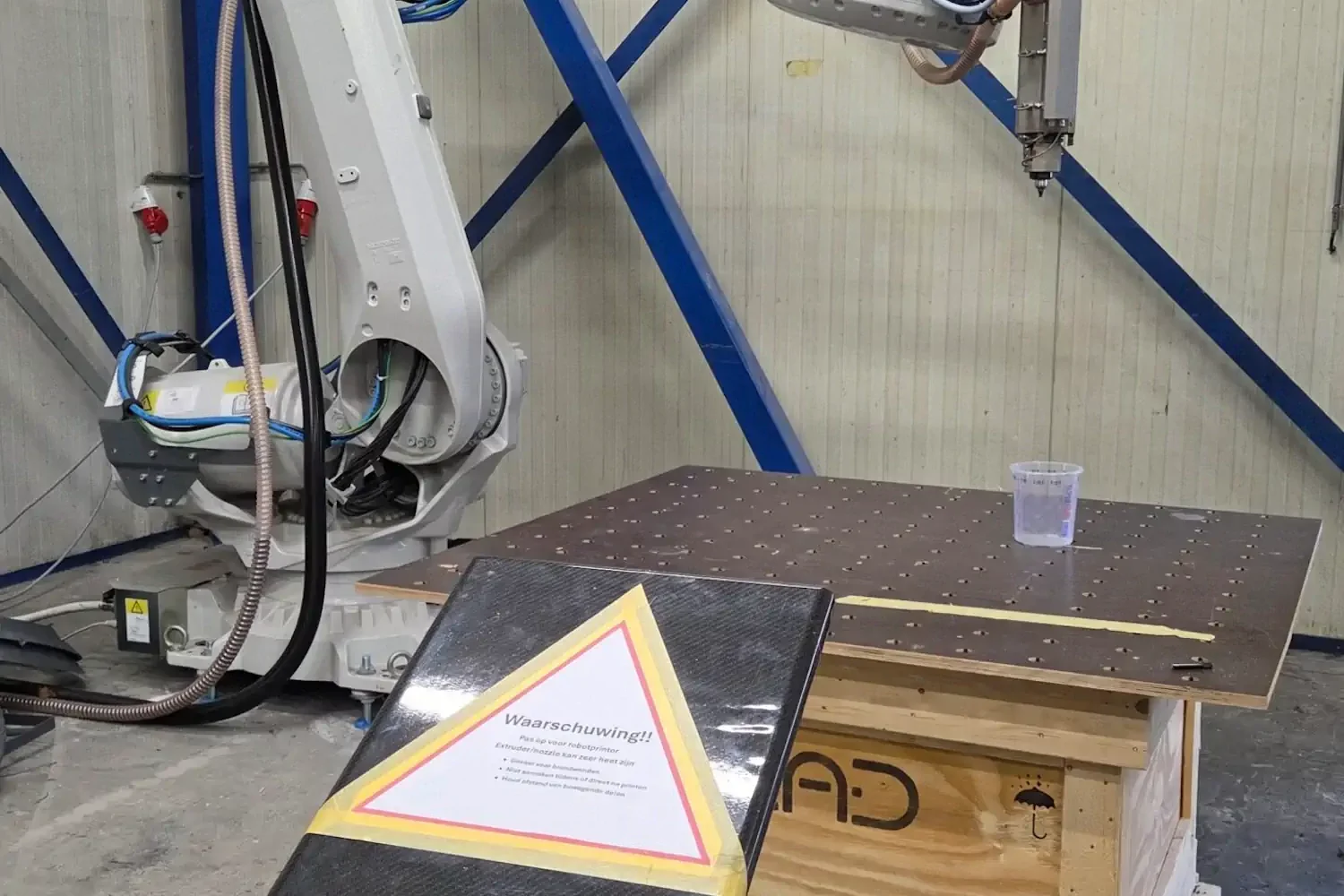 Robot arm above a worktable