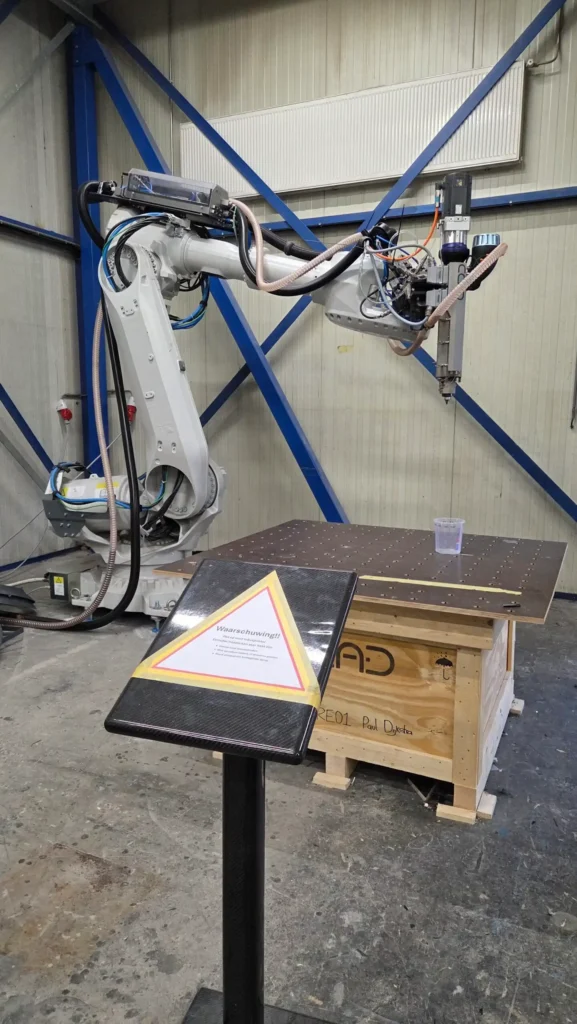 Robot arm above a worktable