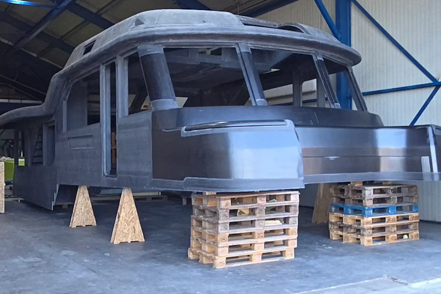Boat hull on pallets in the workshop