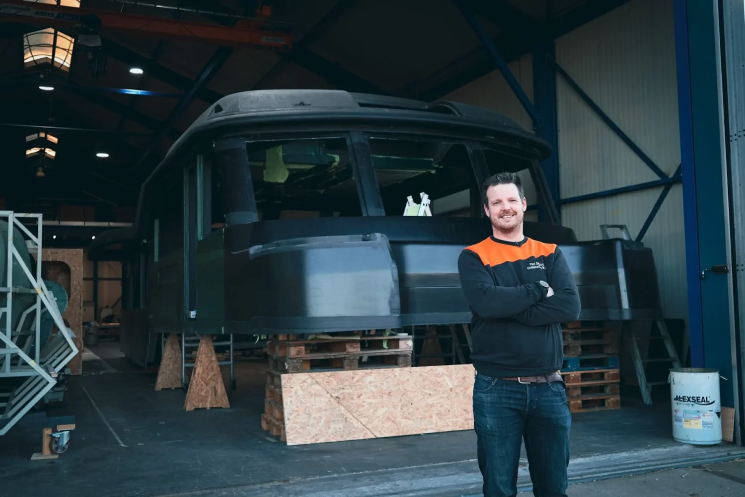 Worker in front of a boat superstructure in the workshop