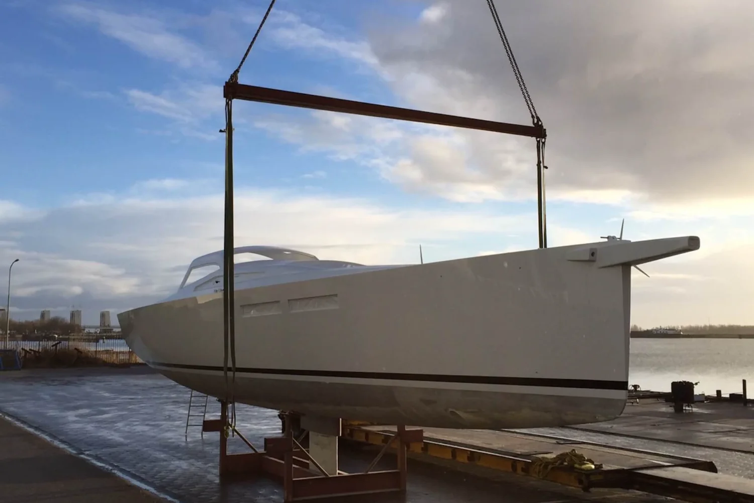 Side view of a boat hull being lifted