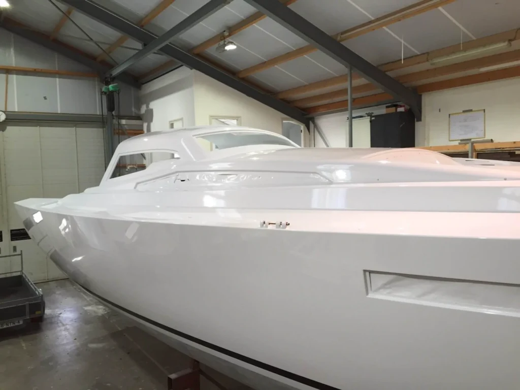 Finished white motorboat in the workshop
