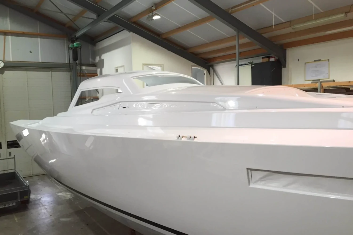 Finished white motorboat in the workshop