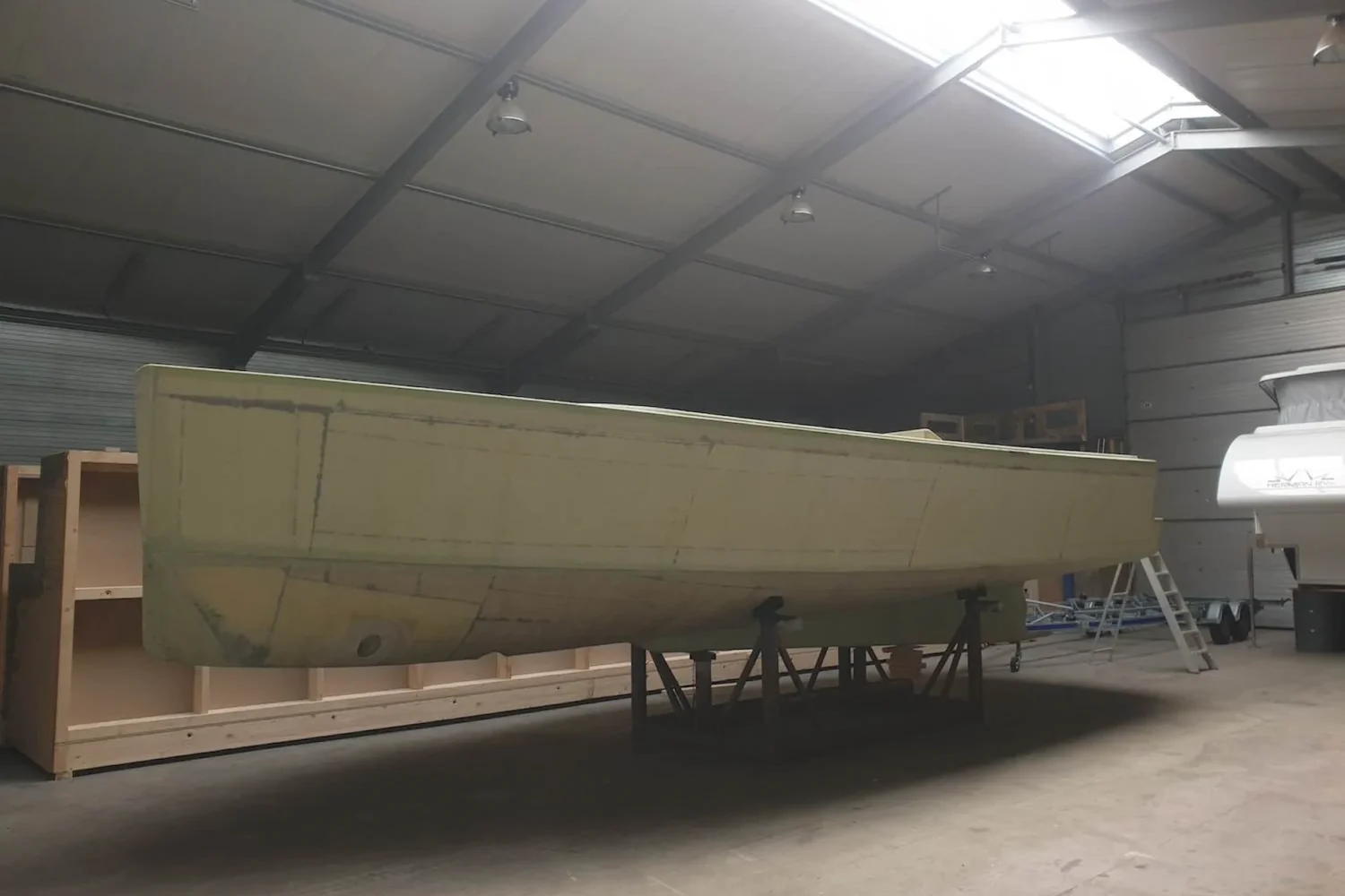 Boat hull on supports in the workshop